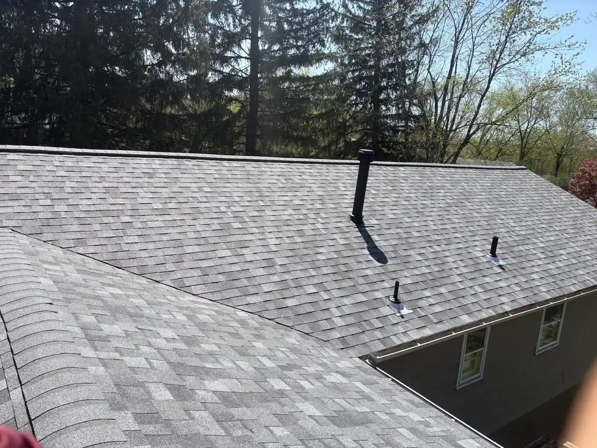 Aerial view of a finished gray architectural shingle roof