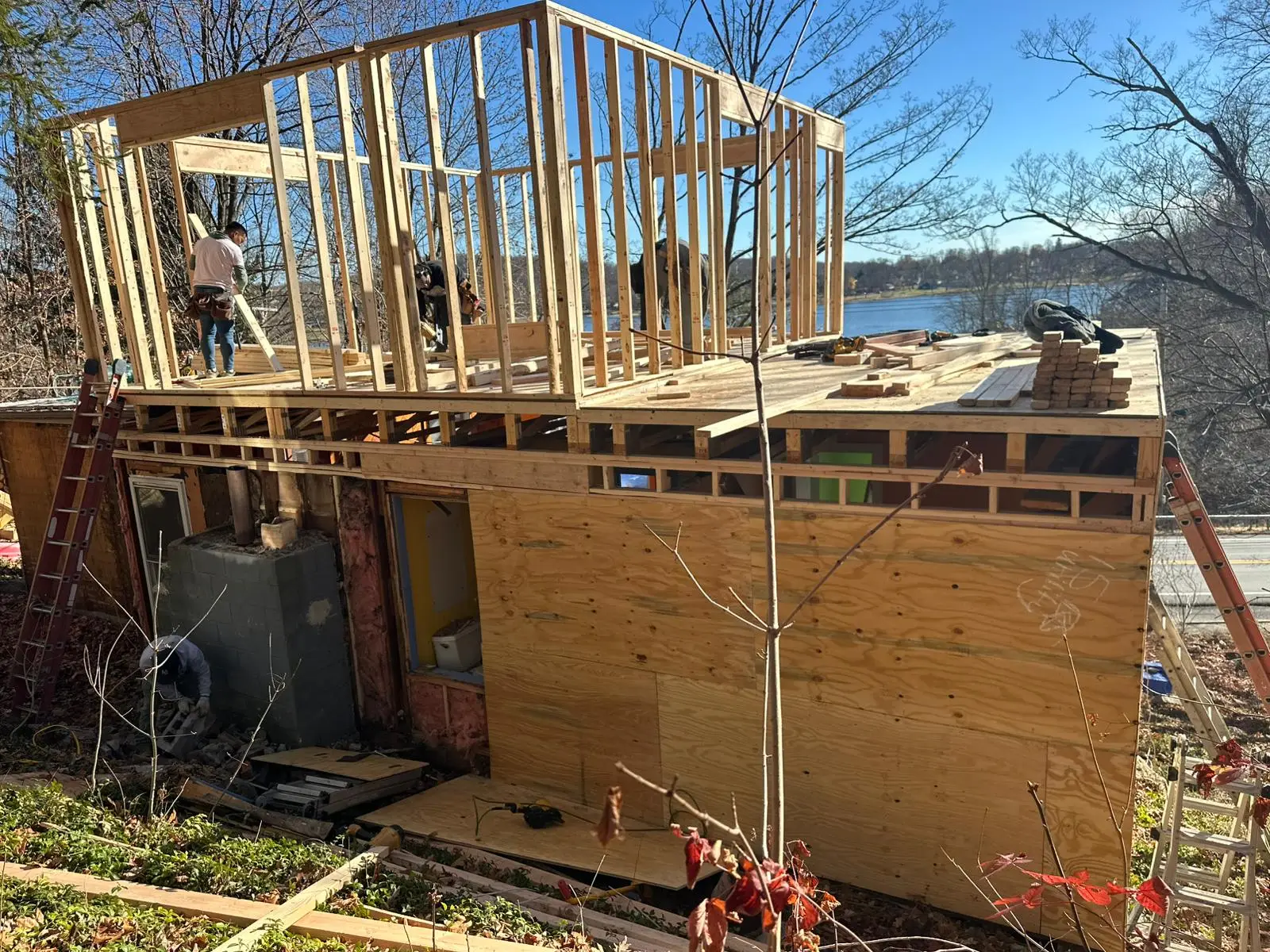 Second-story addition framing on a home near the water