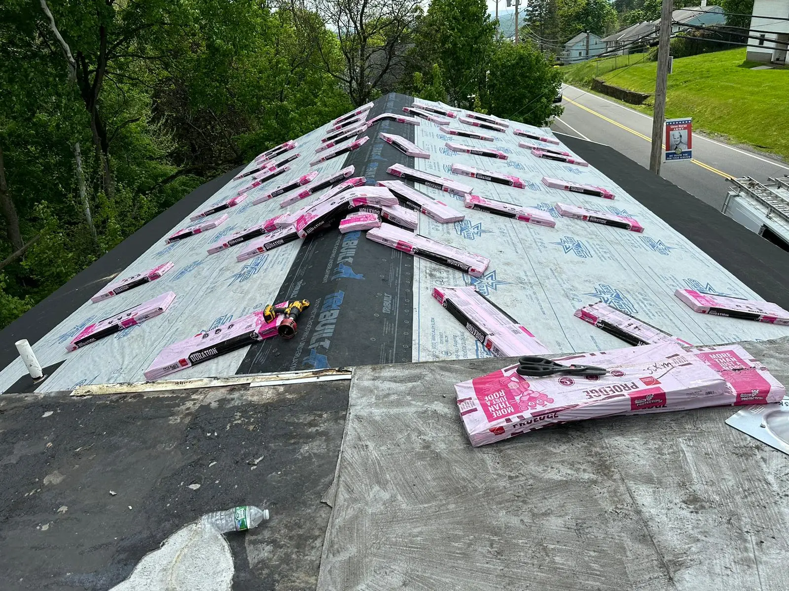 GAF Duration shingle bundles staged on a roof deck ahead of installation