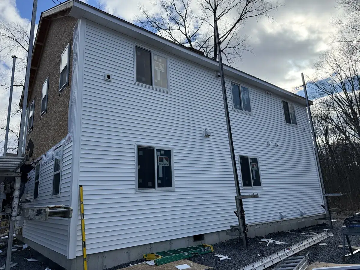 New white siding installed on a two-story home in Gardiner, NY