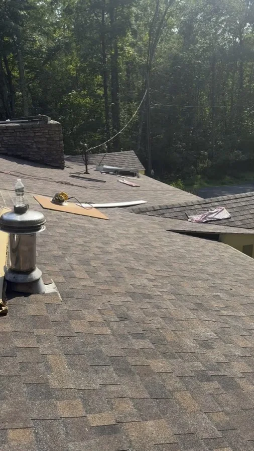 Ridge line and valley work on a large multi-section shingle roof
