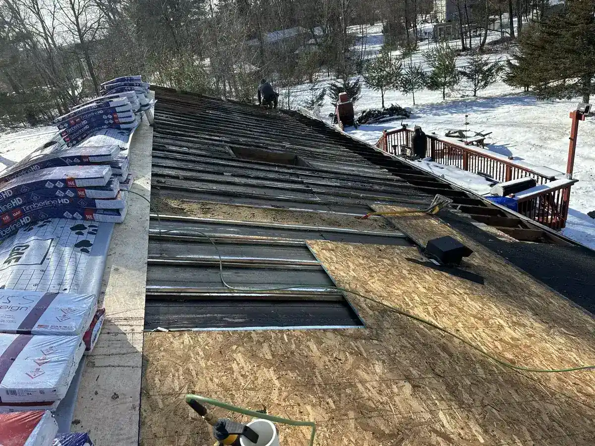 Roof tear-off exposing the original deck boards on a home in East Fishkill, NY