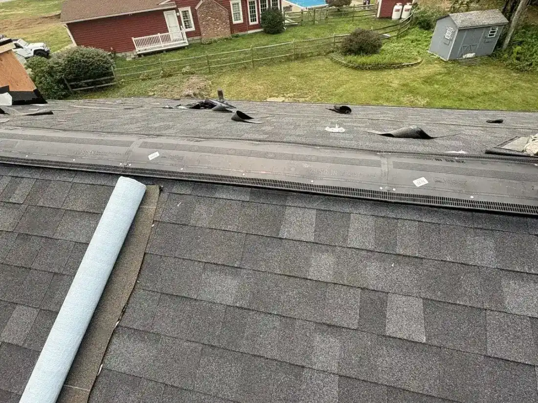 New architectural shingles and ridge vent material on a roof in Hyde Park, NY