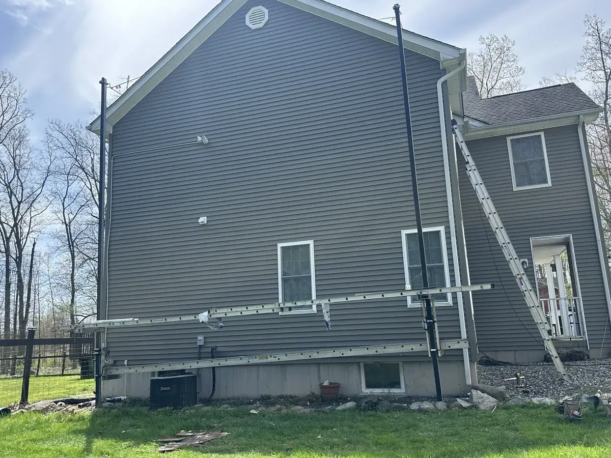 Ladder and staging set for siding work at a home in Gardiner, NY