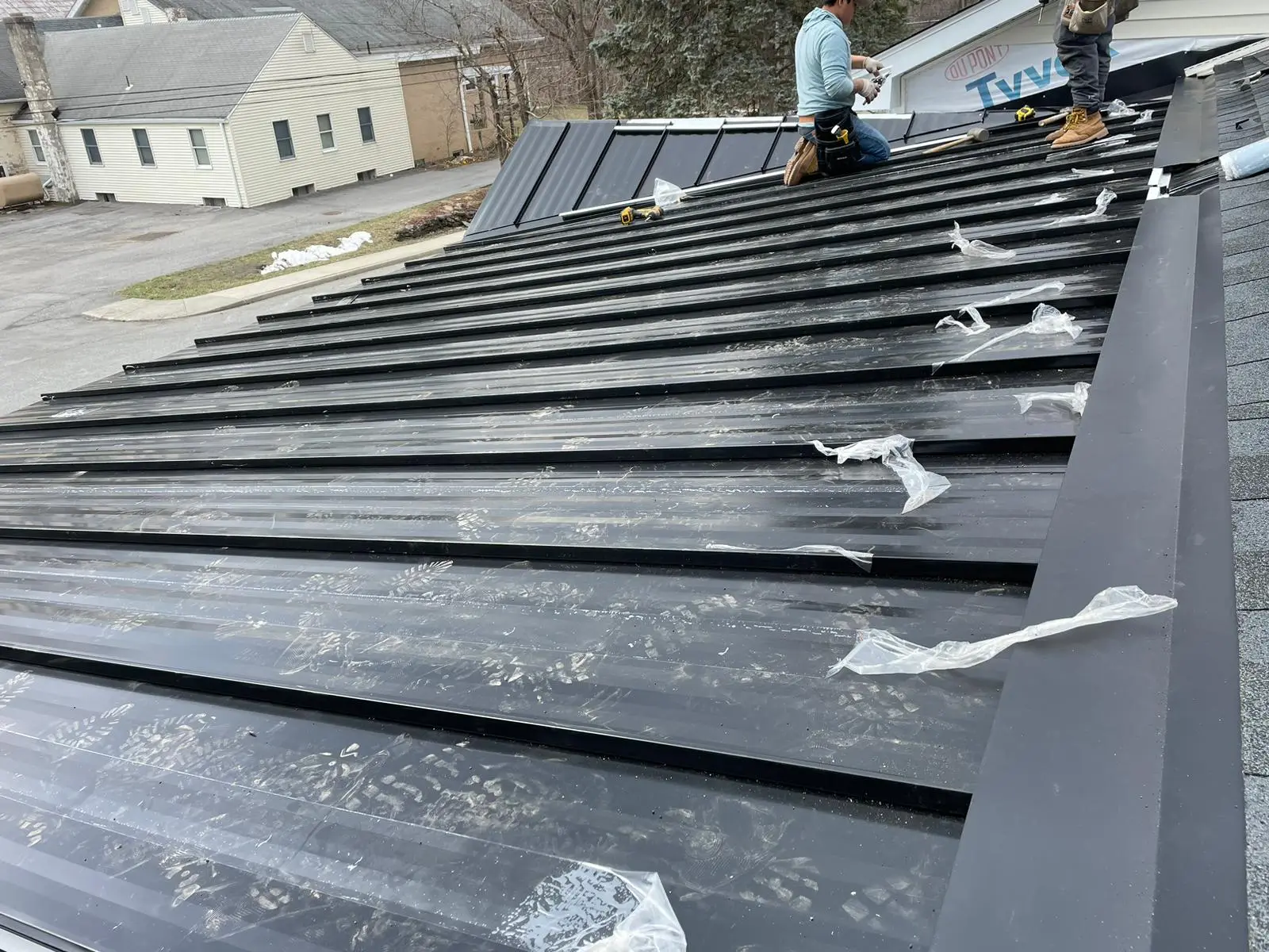 Standing-seam metal roofing installed over synthetic underlayment